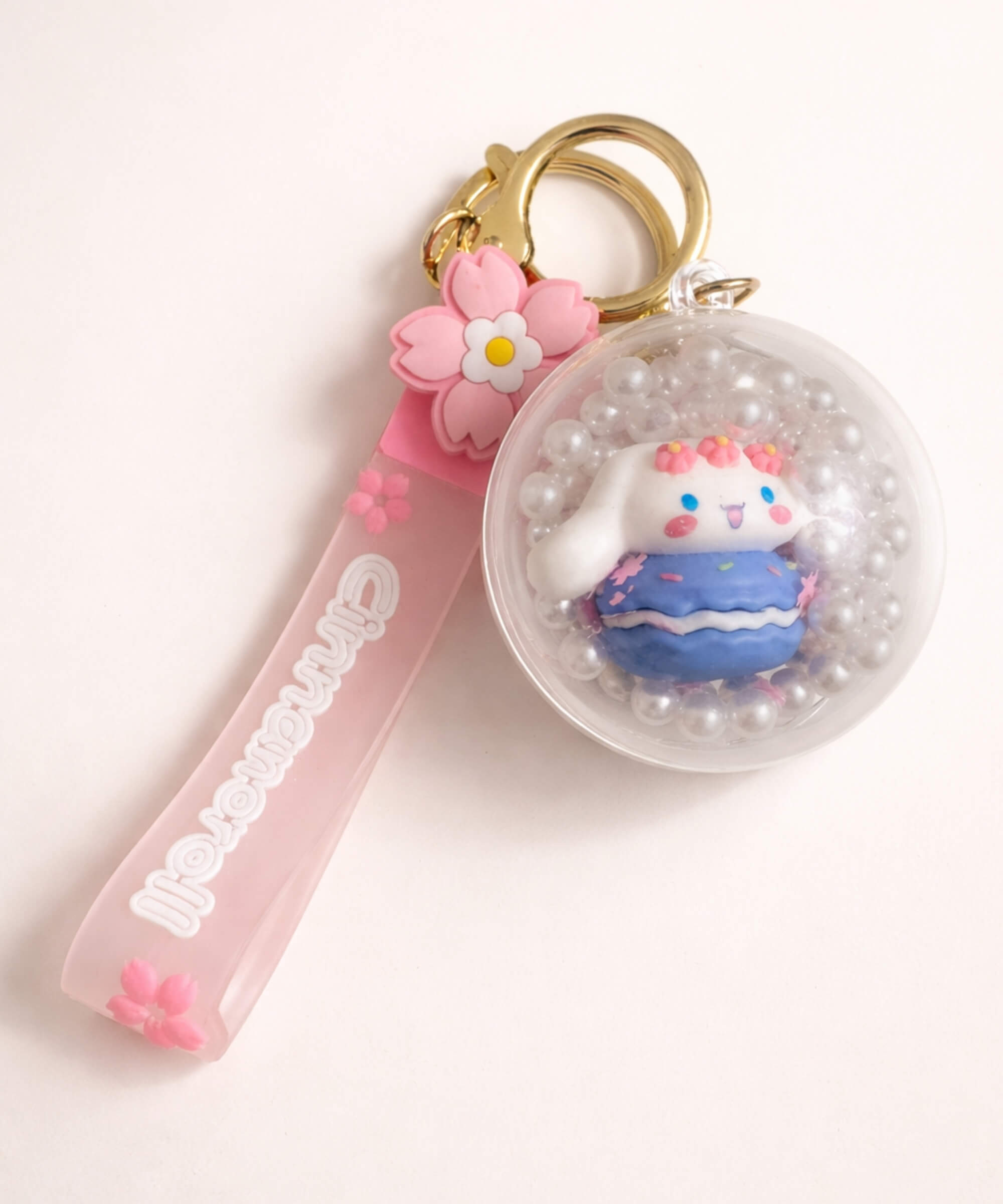 Cinnamoroll macaron shaker keychain with floating beads inside clear charm